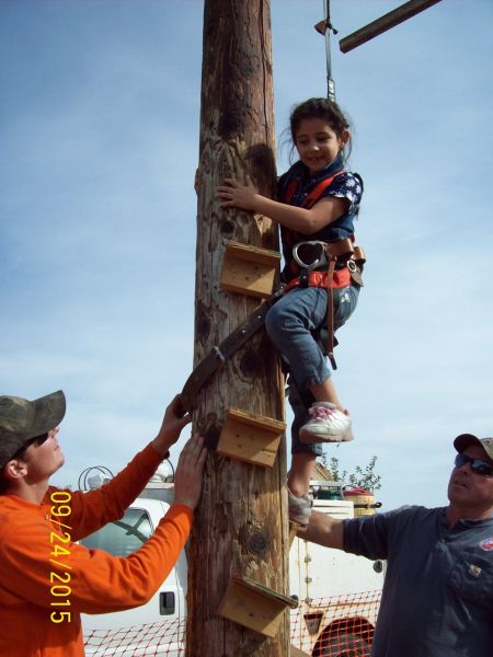 Kid climbing power pole